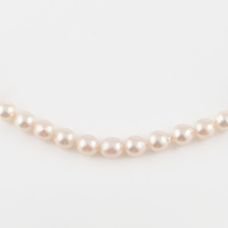 Three strands of cultured pearls, without clasps.