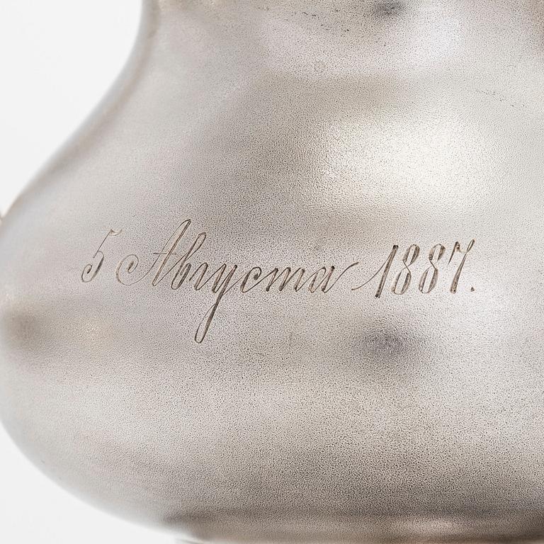 A four-piece silver coffee set, St. Petersburg 1887, original fitted box from Khlebnikov. Sugar tong, Moscow around 190.