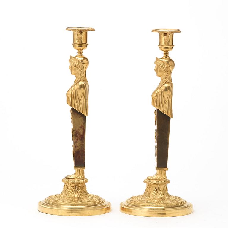 A pair of Empire circa 1810 candlesticks.