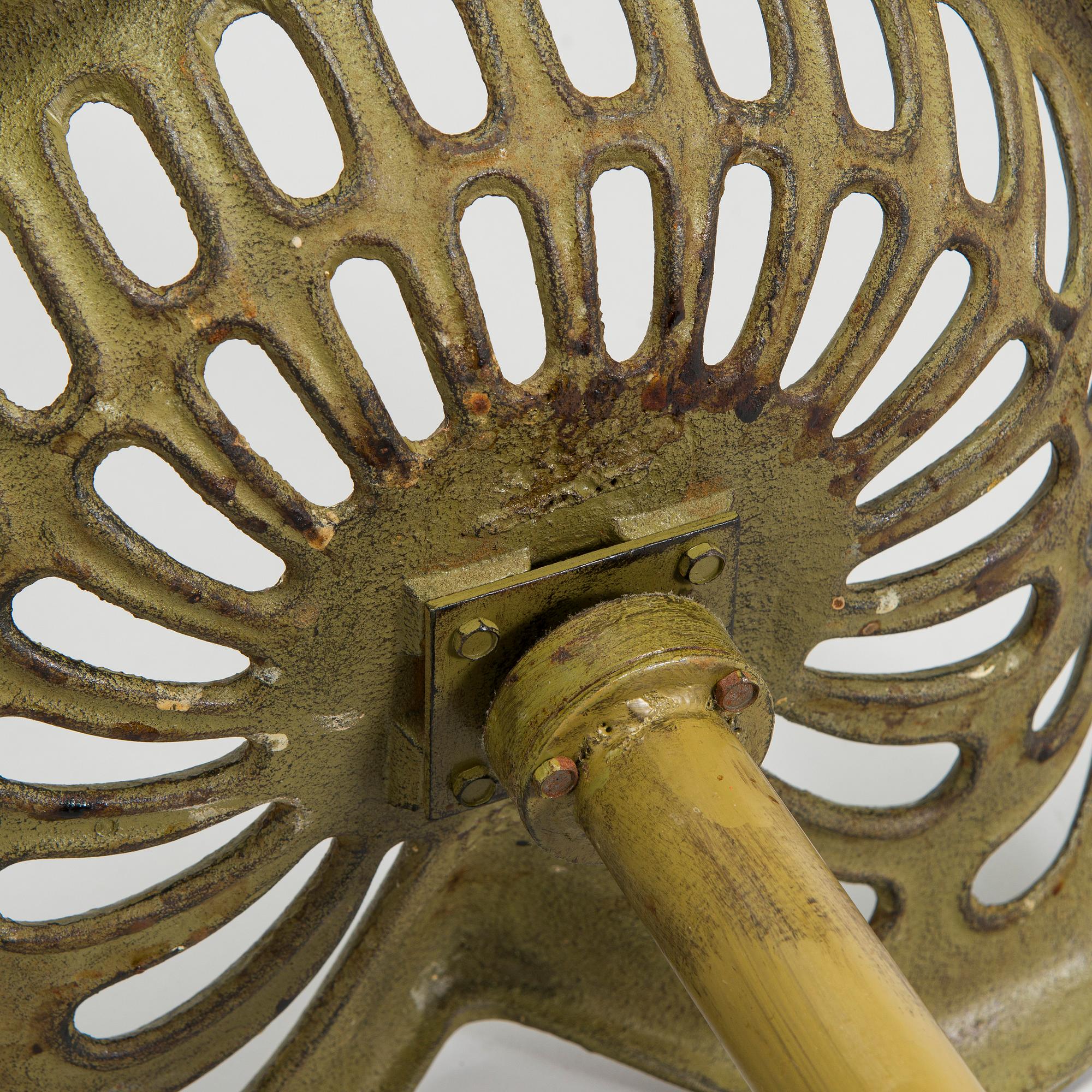 Four bar stools, painted cast iron, partly from the early 20th century.