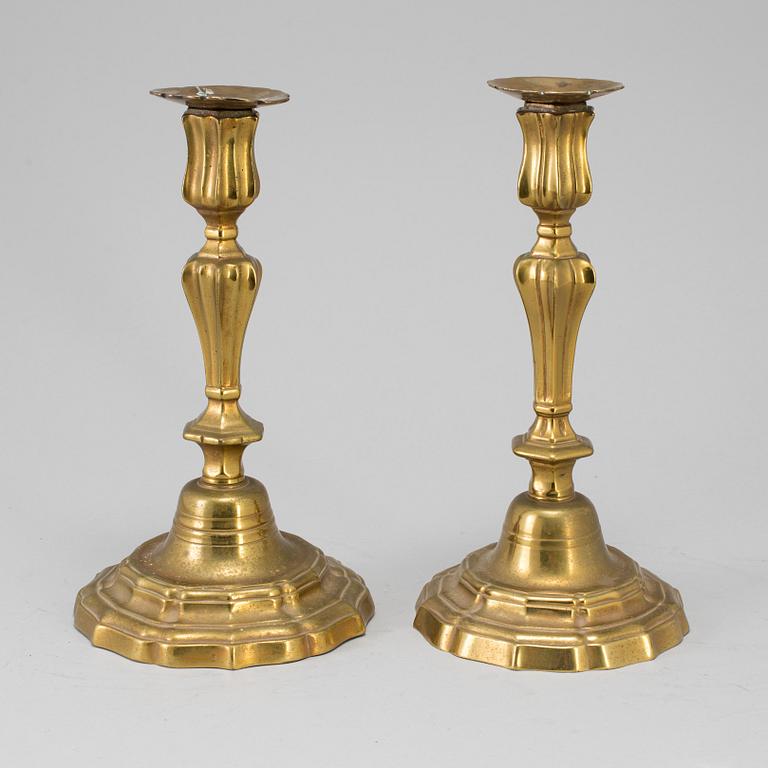 A pair of 18th century bronze candlesticks.