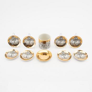 Piero Fornasetti, a set of eight small plates and a mug Italy mid 1900s.
