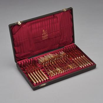 An early 19th century silver-gilt 24 piece table cutlery, mark of P Zethelius and G Folcker, Sthlm 1806 and 1826.