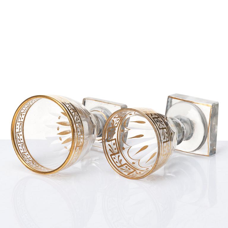 A set of Russian glasses (13 pcs.) and a bottle with stopper, 19th Century.