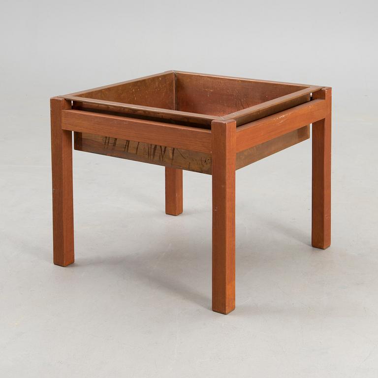 A mid-20th century flower table for Puunveisto Oy - Träsnideri Ab, Finland.