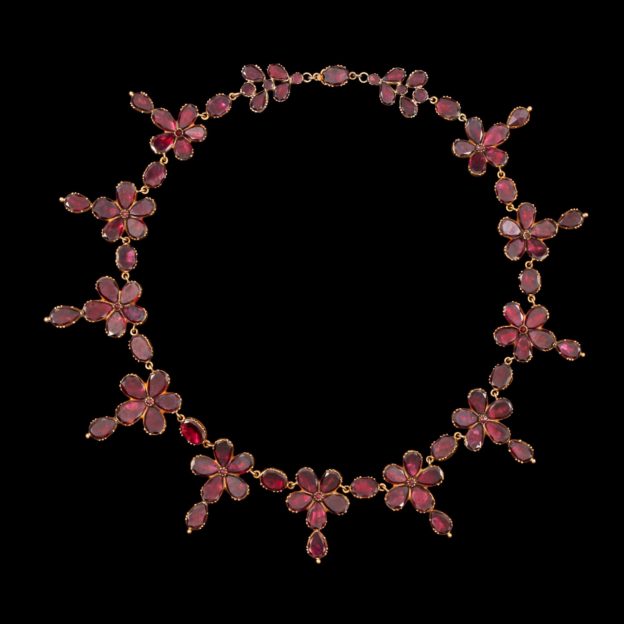 A Georgian garnet necklace. Probably England circa 1820.