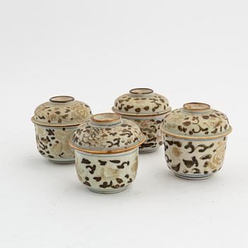 A set of four Chinese porcelain cups with cover, Qing dynasty, 18th Century.