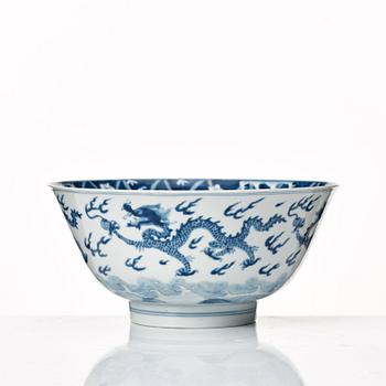 A blue and white four clawed dragon bowl, Qing dynasty, with Kangxis six character mark and period.