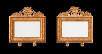 641. A pair of Swedish Empire first half 19th century two-light girandole mirrors.