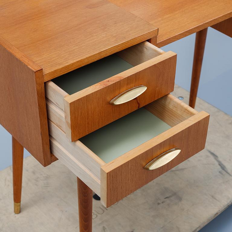 A teak makeup-table from the mid 20th century.