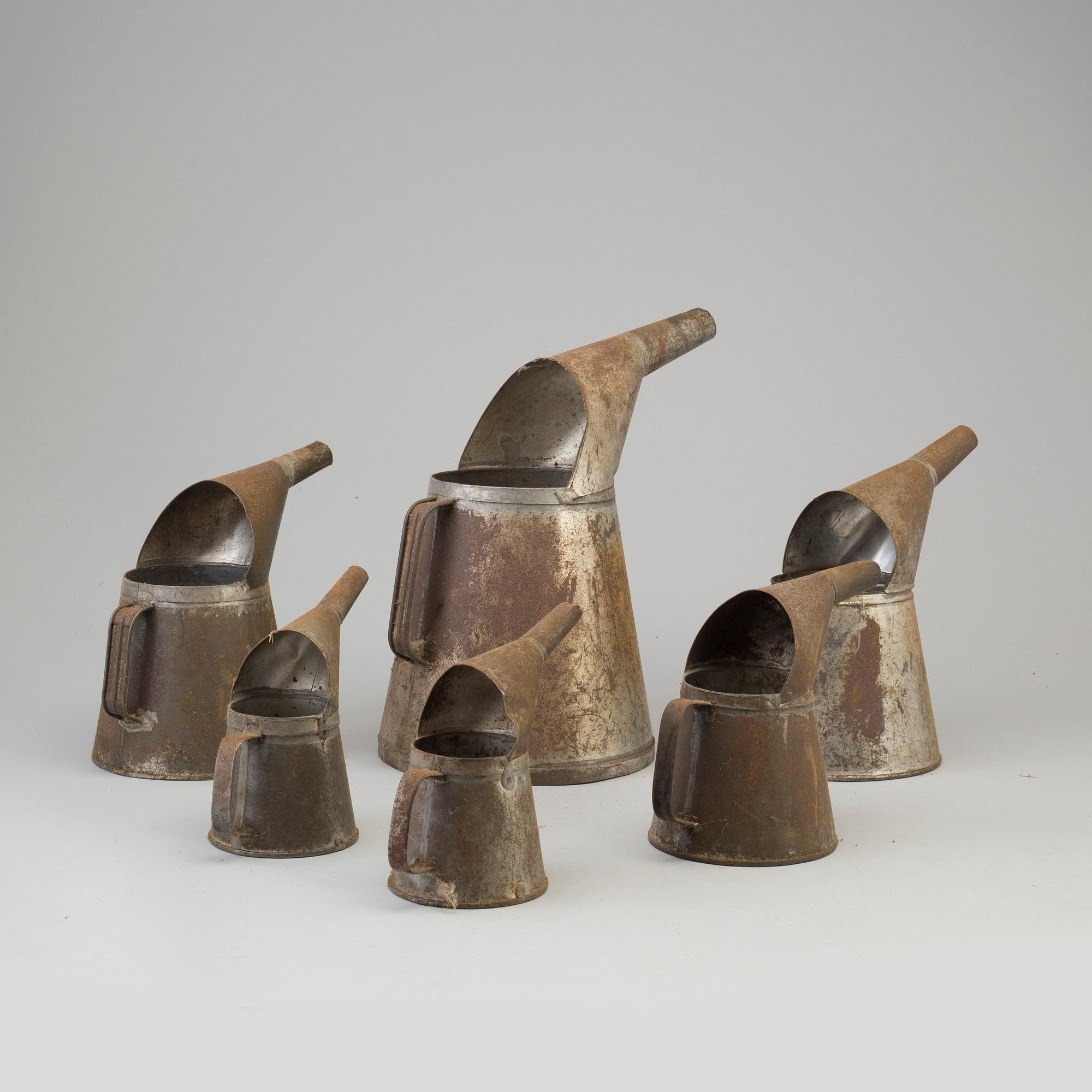 Six tin oil jugs, first half of the 20th Century.