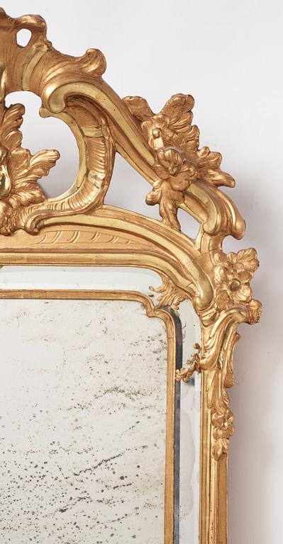 A Rococo giltwood mirror by N. Meunier (master in Stockholm 1754-97).