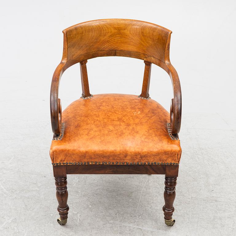 An Empire armchair, 19th century.