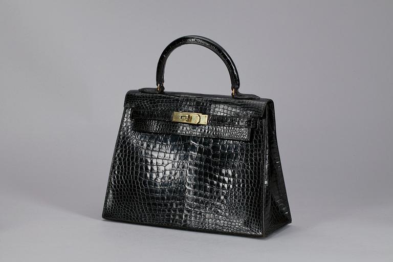 A 1960s/70s black alligator "Kelly" handbag by Hermès.