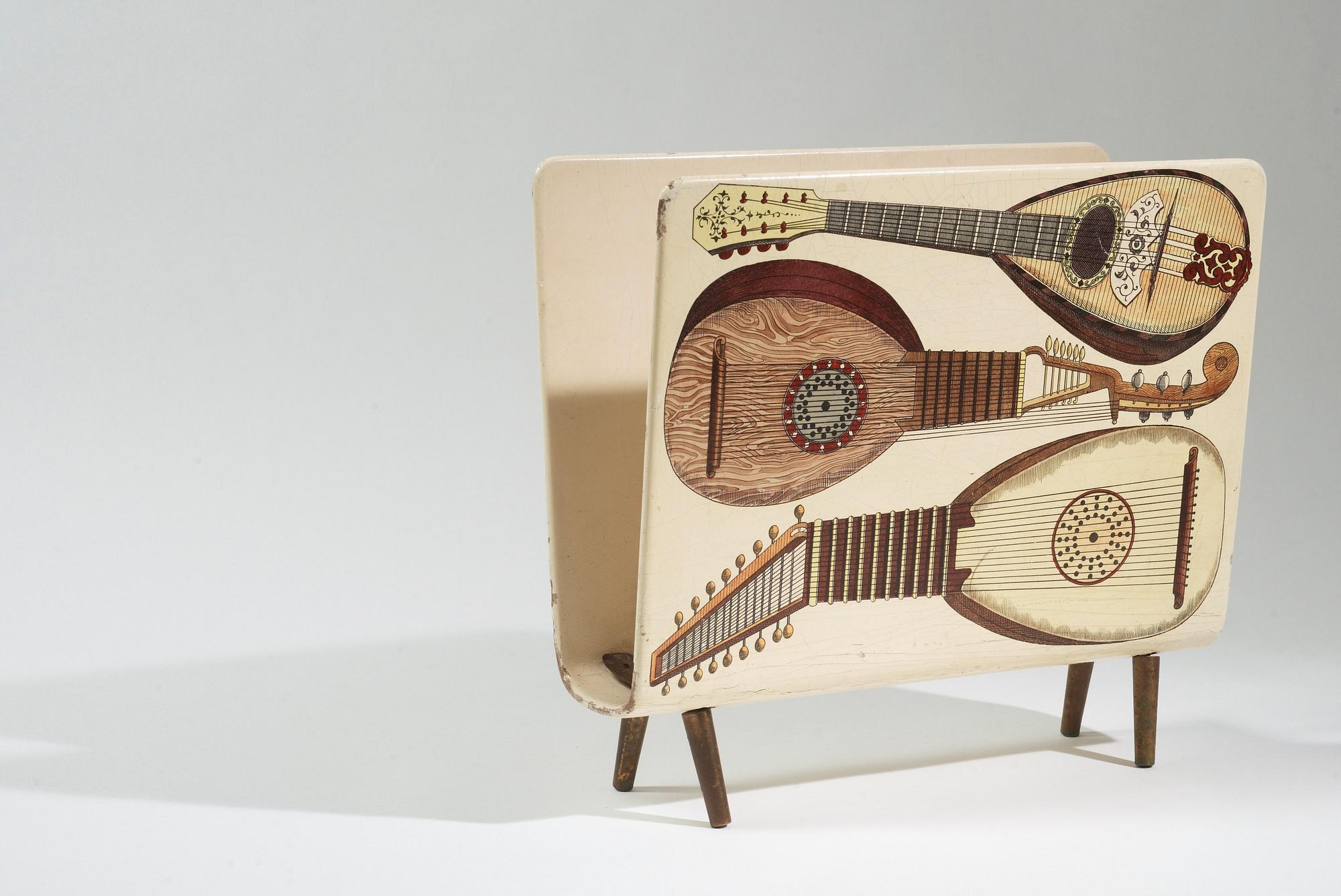 A Piero Fornasetti magazine rack, Milano, Italy 1950's.