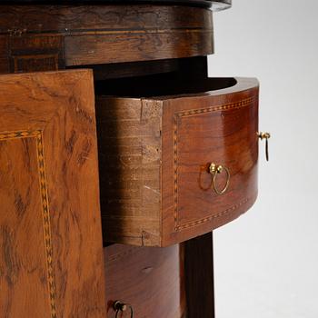 A small cabinet with drawers from around the year 1900.