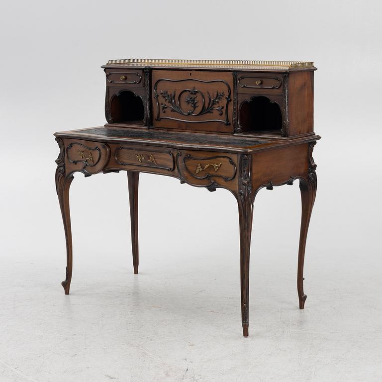 A mahogany veneered desk, mid 20th Century.