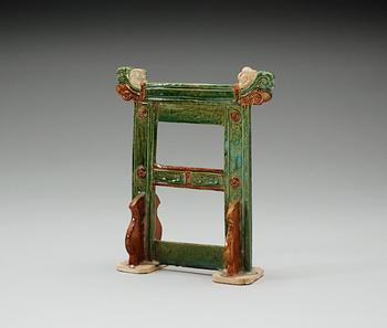 A green and brown glazed pottery stand/gate, Ming dynasty (1368-1644).