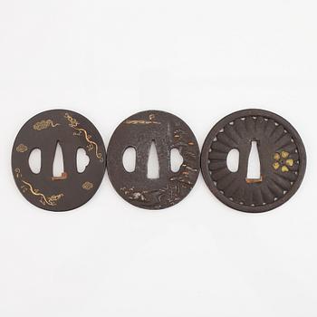 Five iron tsubas, one signed, Edo period.