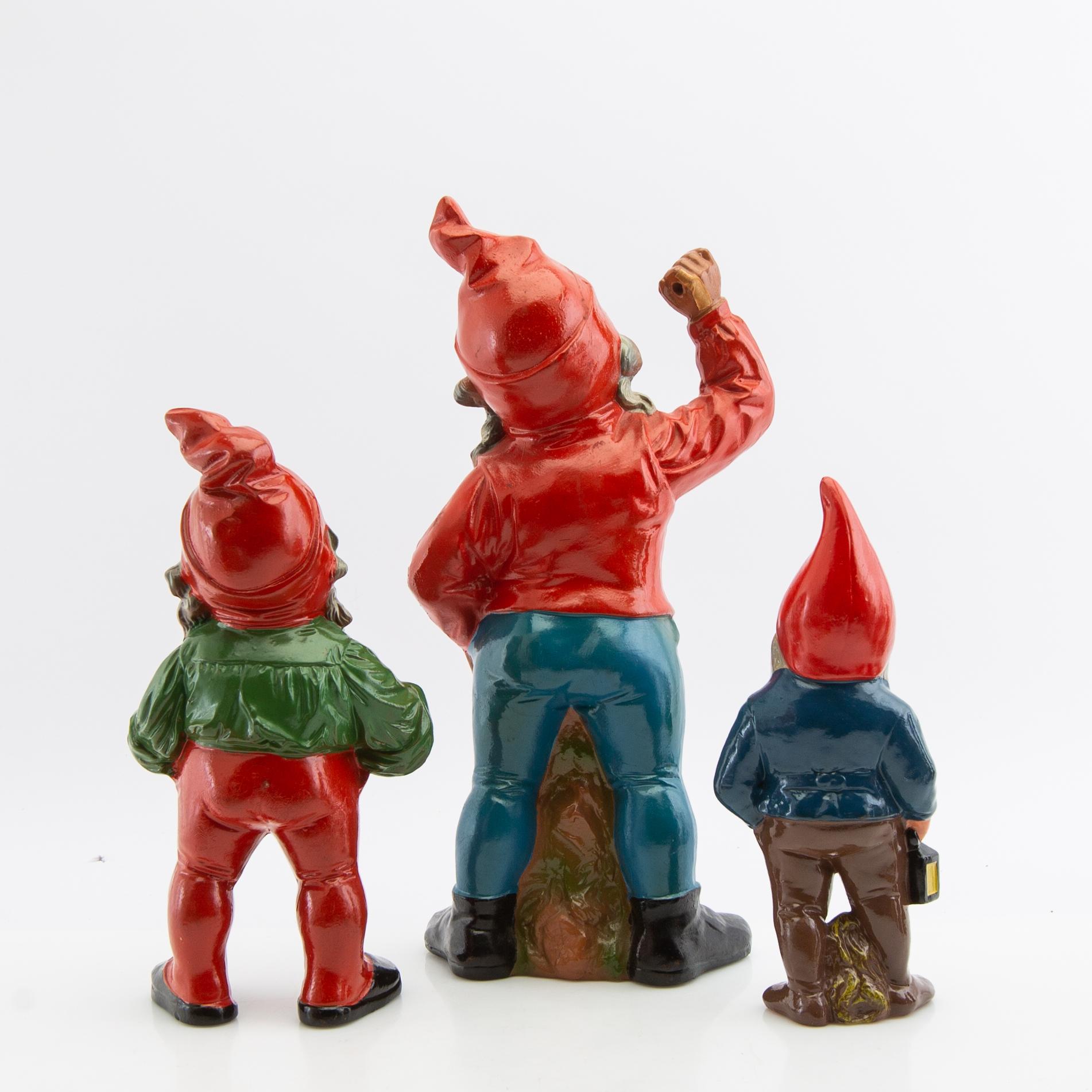 A collection of gnomes 12 pcs mid/late 20th century mostly painted terracotta.