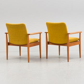 A pair of "Diplomat" easy chairs by Finn Juhl.