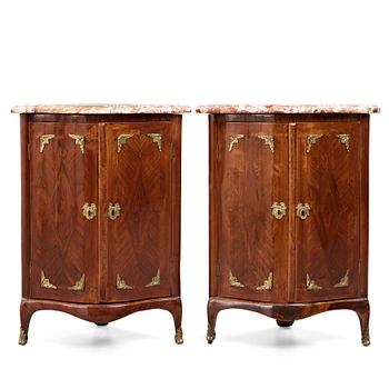 A pair of transiton 18th century corner cabinets by Pierre Migeon (probably Pierre III, master in Paris 1761-1775),