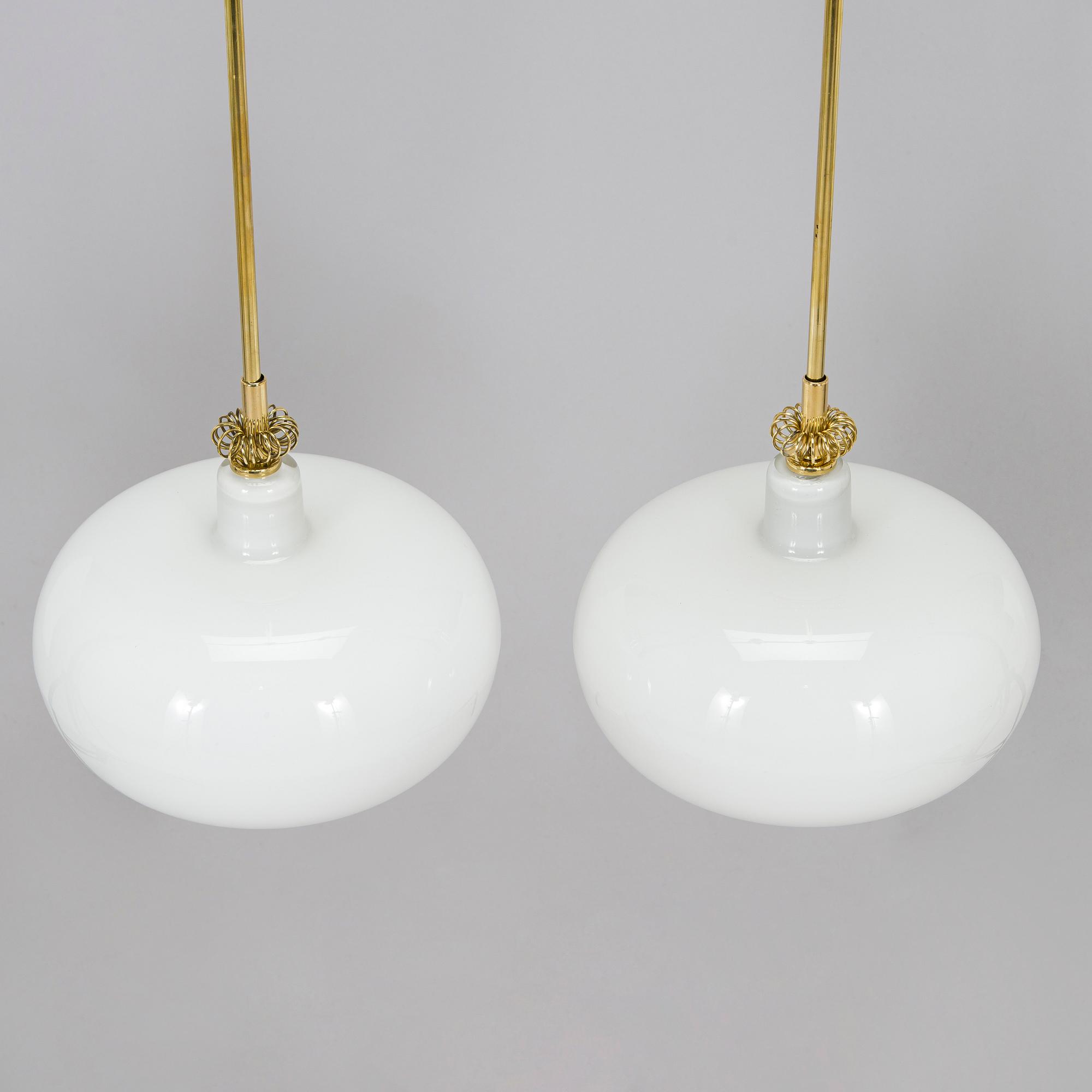 Paavo Tynell, a pair of mid-20th century 'K2-19' pendant lights for Idman.