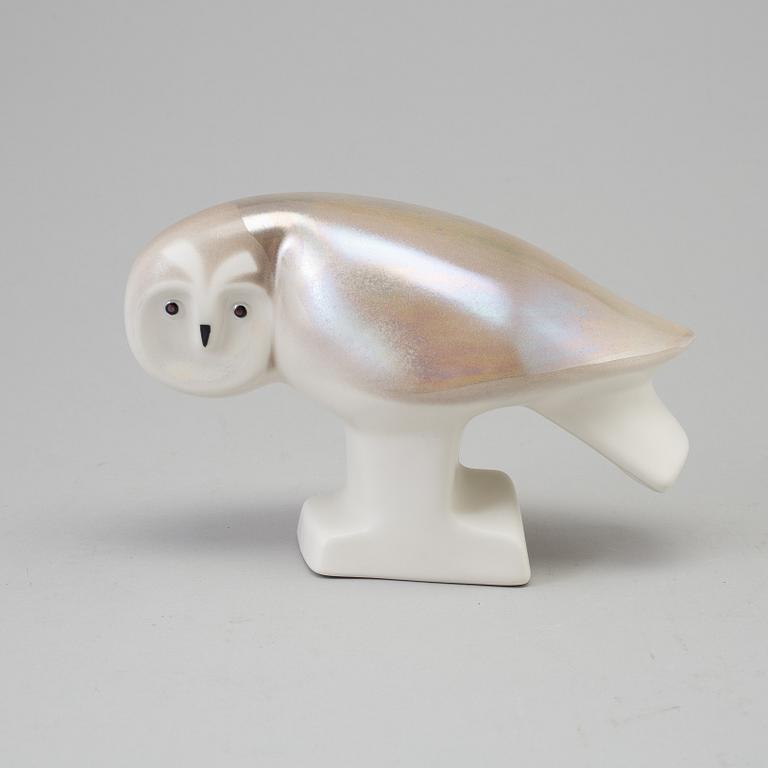 A stoneware figurine, signed Lillemor. By Arabia for WWF in the 1980s.