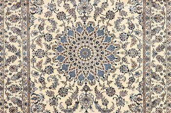 A Nain, part silk carpet, c. 337 x 244 cm.