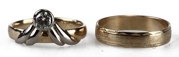 RINGAR, 2 st, 18k guld samt briljantslipad diamant,  0,29 enl intyg.
