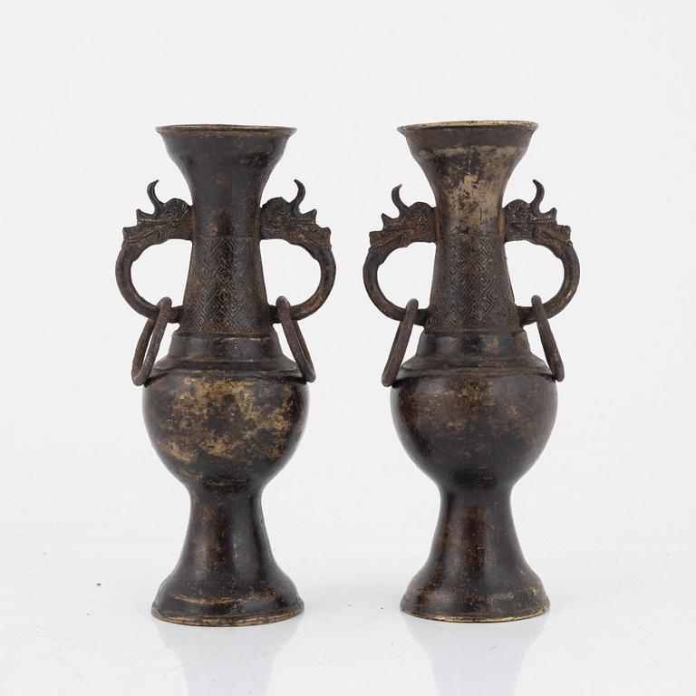 A pair of Chinese bronze altar vases, Ming dynasty (1368-1644).