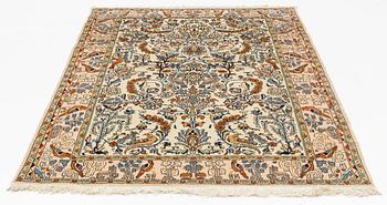 A Ghom rug, 215 x 144 cm.
