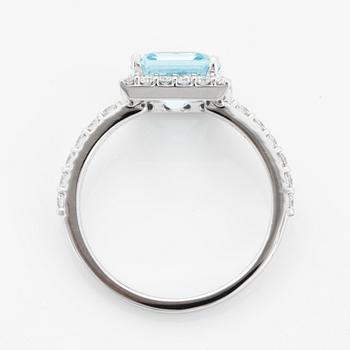 Blue topaz and brilliant-cut diamond ring.