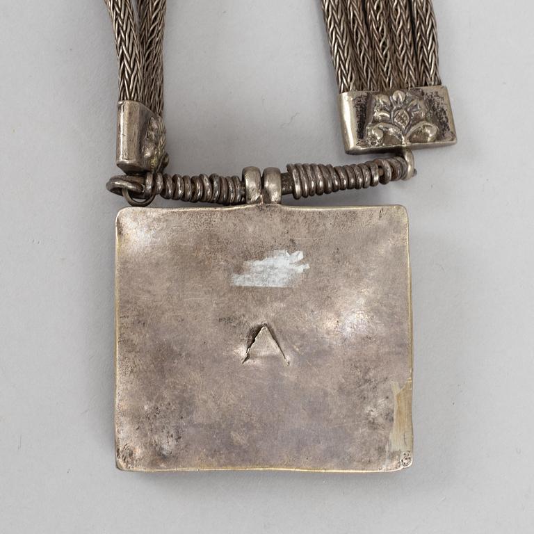 A Tibethan pendant/necklace, circa 1900.