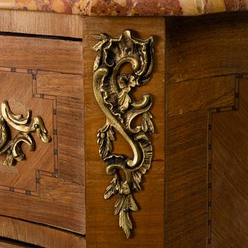 A rococo style chest of drawers.