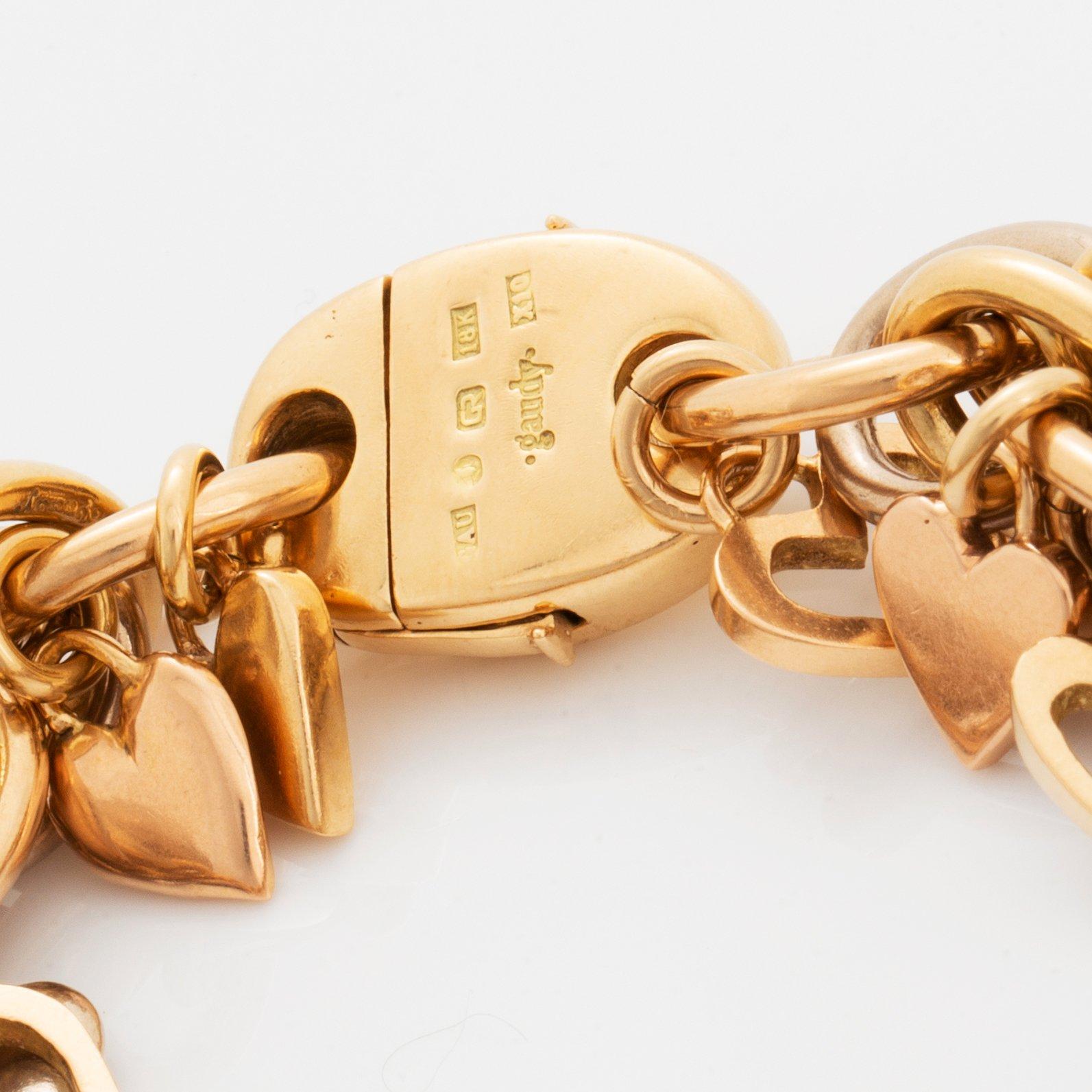 An 18K gold Gaudy bracelet with heart shaped charms.