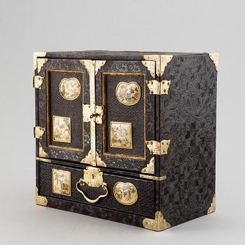 A Japanese lacquered cabinet, Meiji, circa 1900.