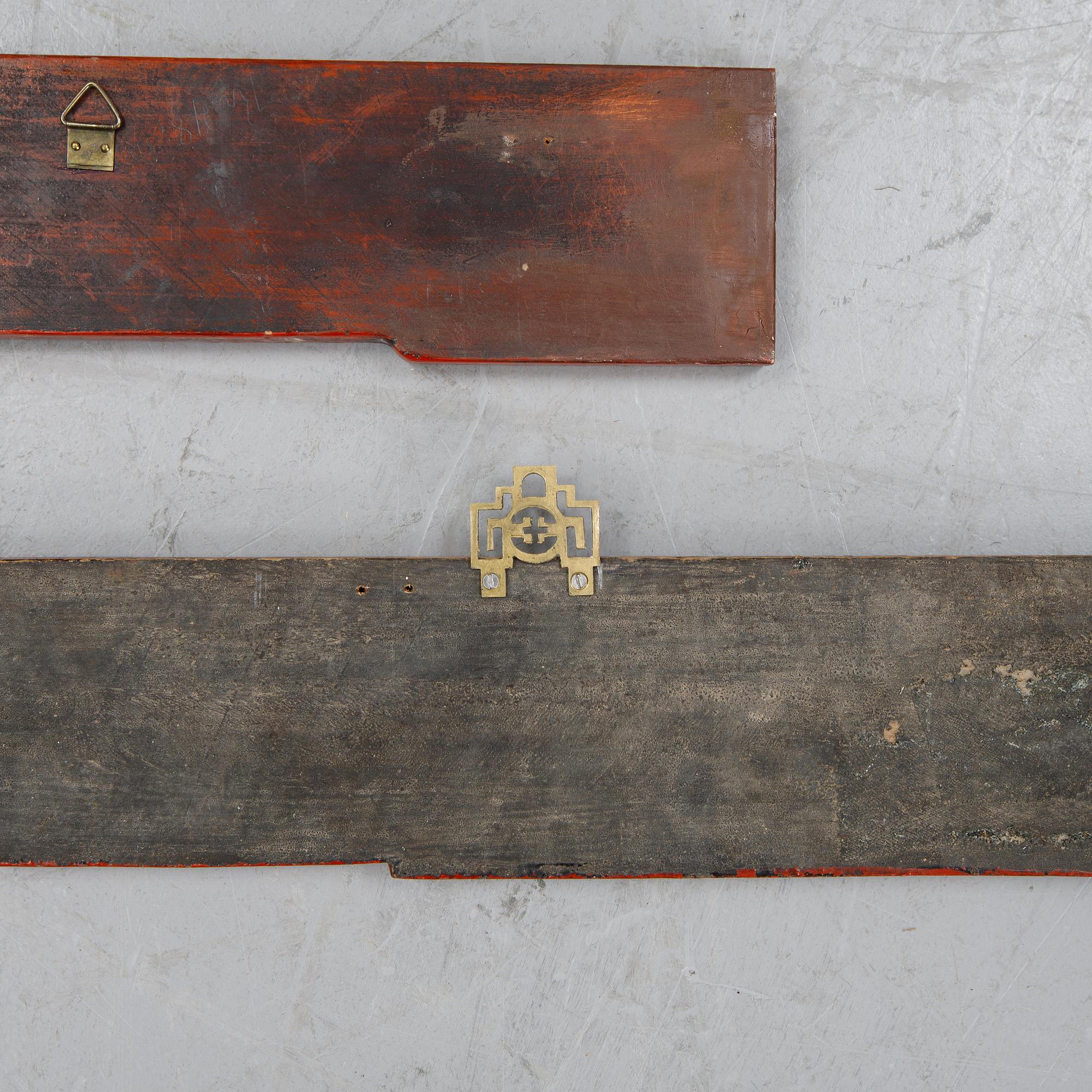 Two Chinese red lacquered wooden panels, 20th century.