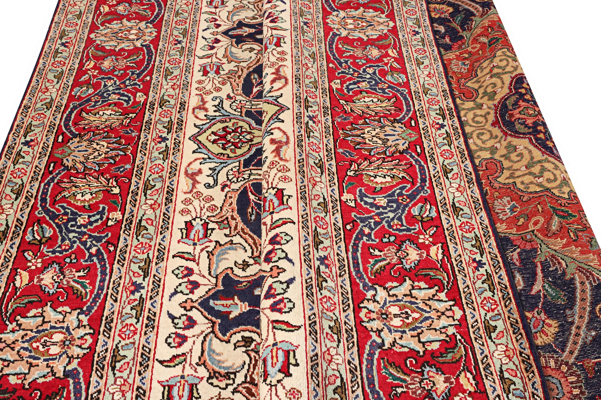A Tabriz carpet, c. 345 x 255 cm.