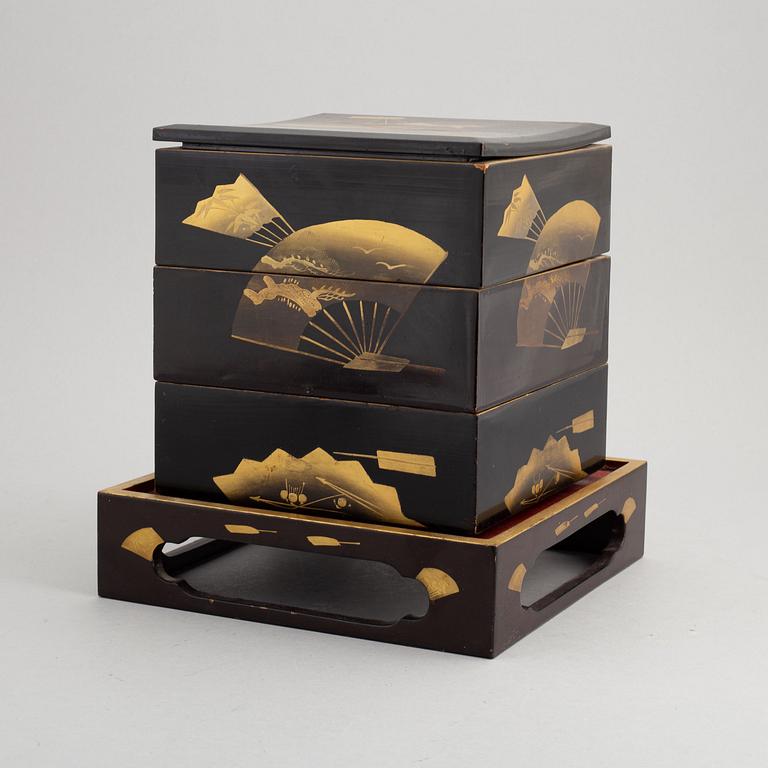 A Japanese lacquer three-tier 'Jubako' (food container) with stand, presumably early 20th century.