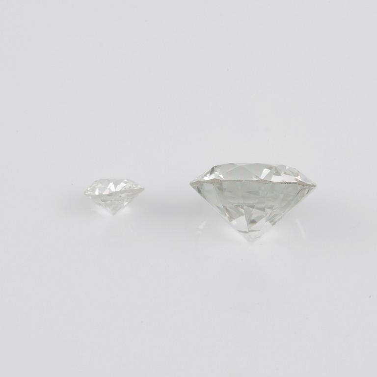 Two loose old-cut diamonds, 1.56 cts circa J/VVS, and 0.18 cts.