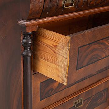 A chest of drawers, circa 1900.