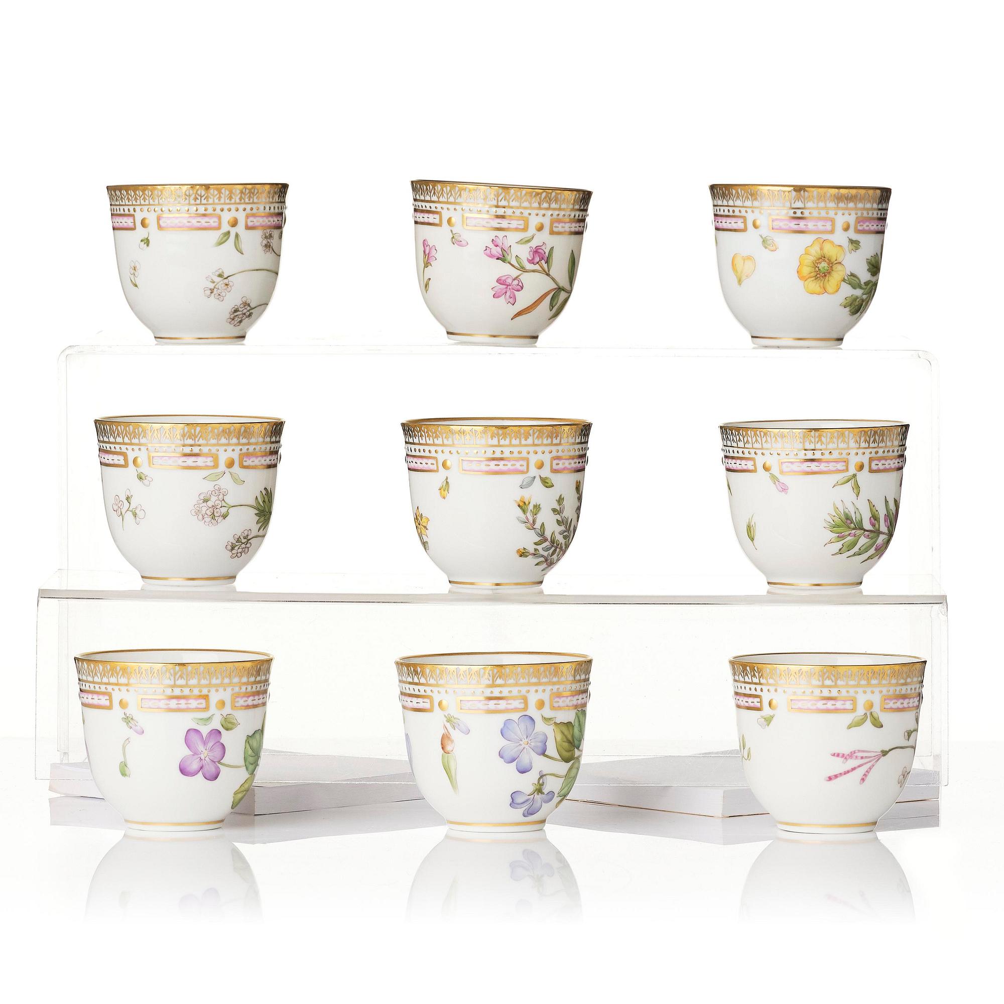 A set of nine Royal Copenhagen 'Flora Danica' cups with saucers, Denmark, 20th century.