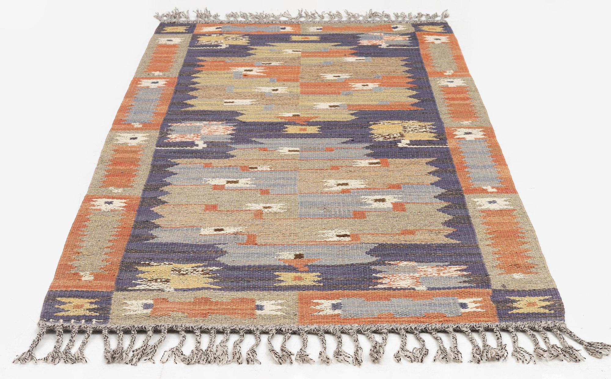 Märta Måås-Fjetterström, a carpet, 'Tolvbladsmattan', flat weave, c. 205 x 95 cm, signed MMF.