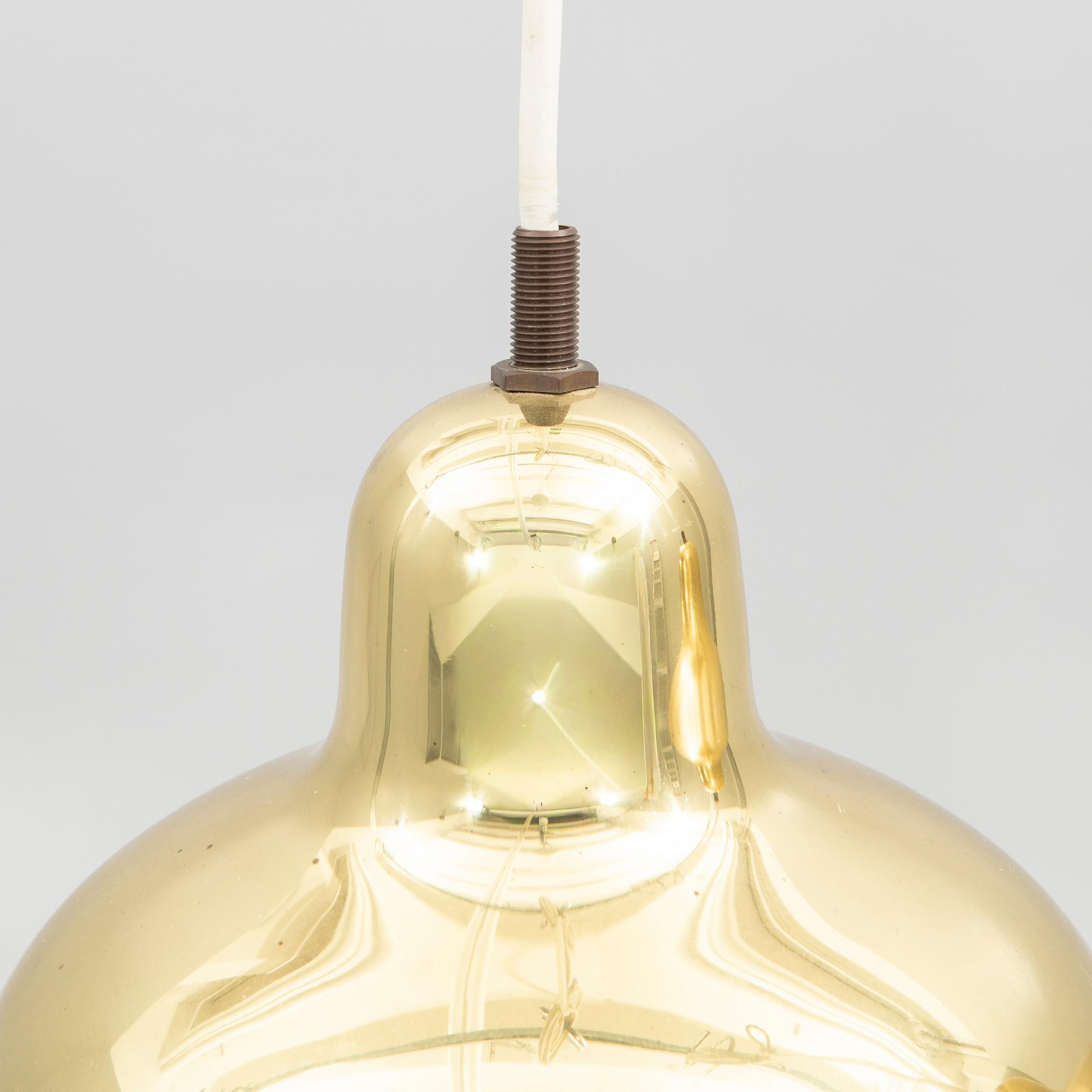 Alvar Aalto, a pair of "Golden Bell" brass pendant lamps, for Artek, Finland, model "A330S".