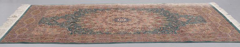 A CARPET, Old silk Qum, signed Moghadam, ca 309,5 x 190,5 - 193 cm.