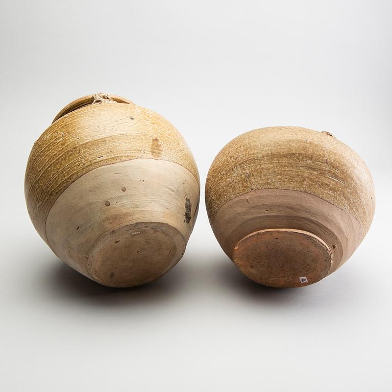 A group of three olive glazed jars, South East Asia, presumably 16th/18th Century.