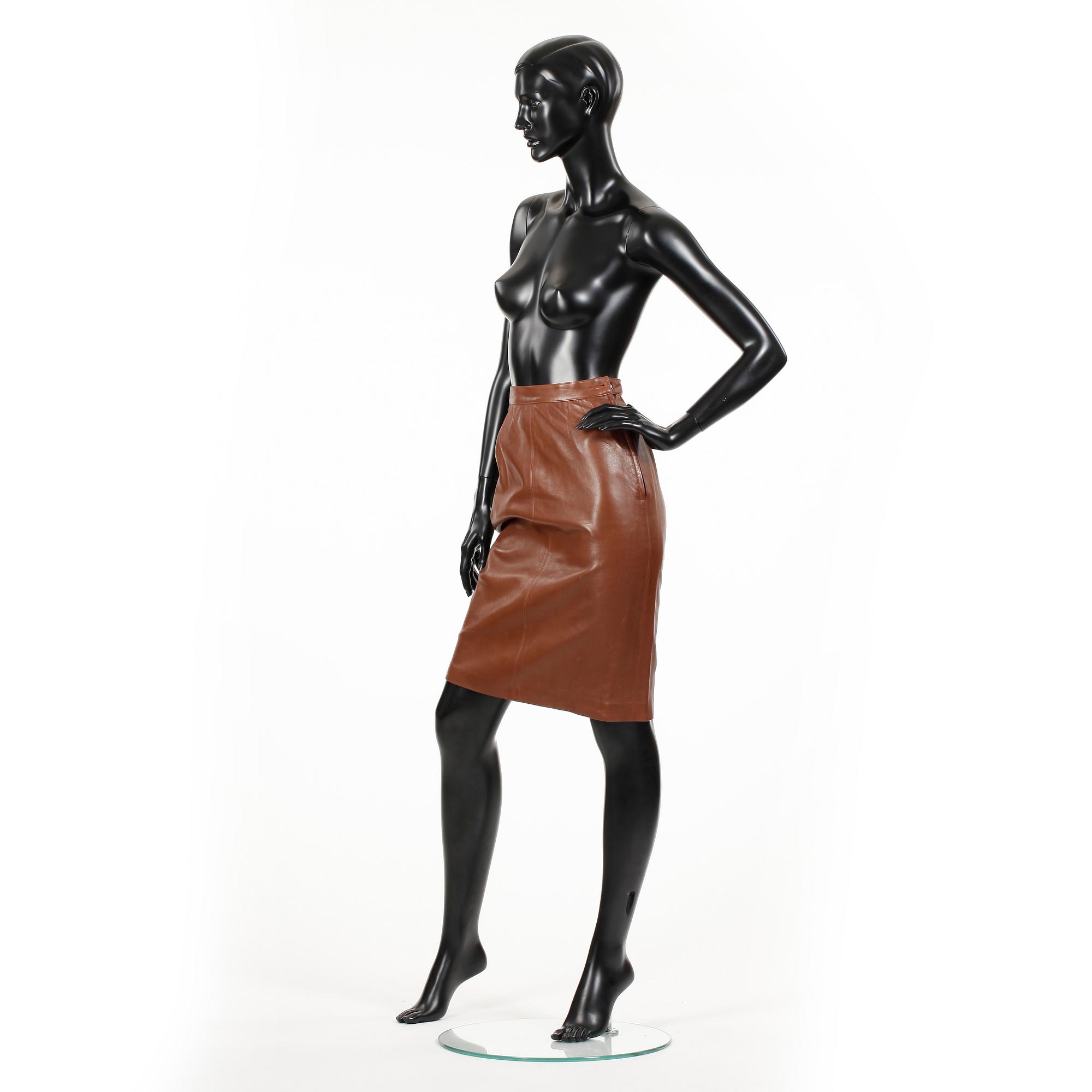YVES SAINT LAURENT, a brown leather skirt.