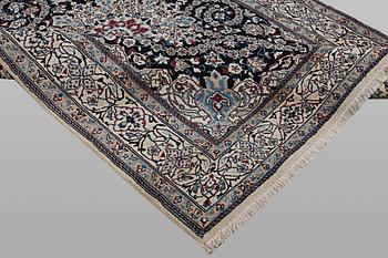 A carpet, Nain, part silk, 9 Laa, ca 295 x 197 cm.