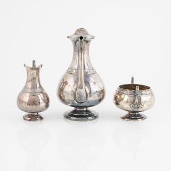 A Swedish Silver Coffee Pot, Creamer and Sugar Bowl, marks of GAB, Stockholm 1875-1897, and GT Folcker 1875.